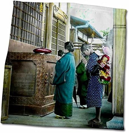3drose familie japoneză rugându-se la templu budist local Zen-prosoape